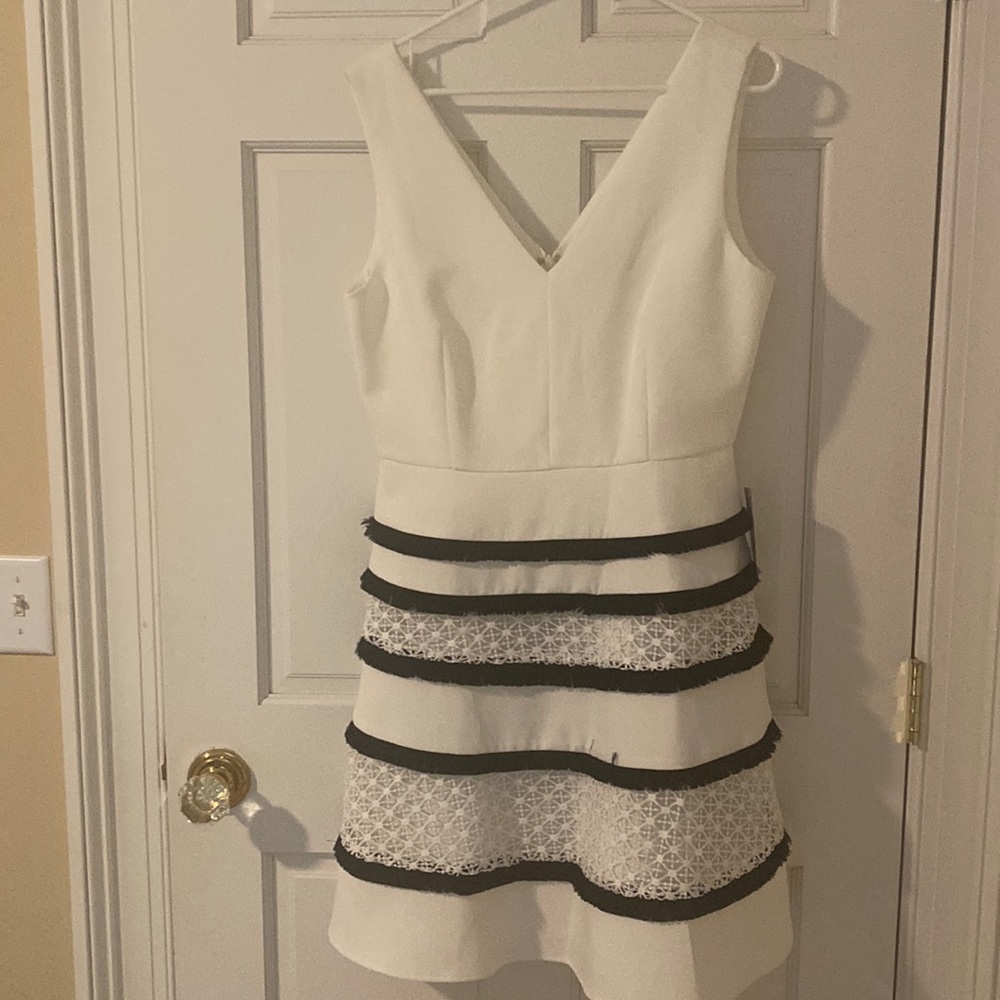 Adelyn Rae white dress with navy fringe and lace detail on the skirt